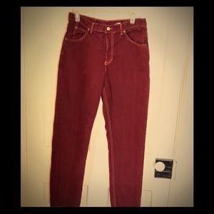 Burgundy colored CK jeans.